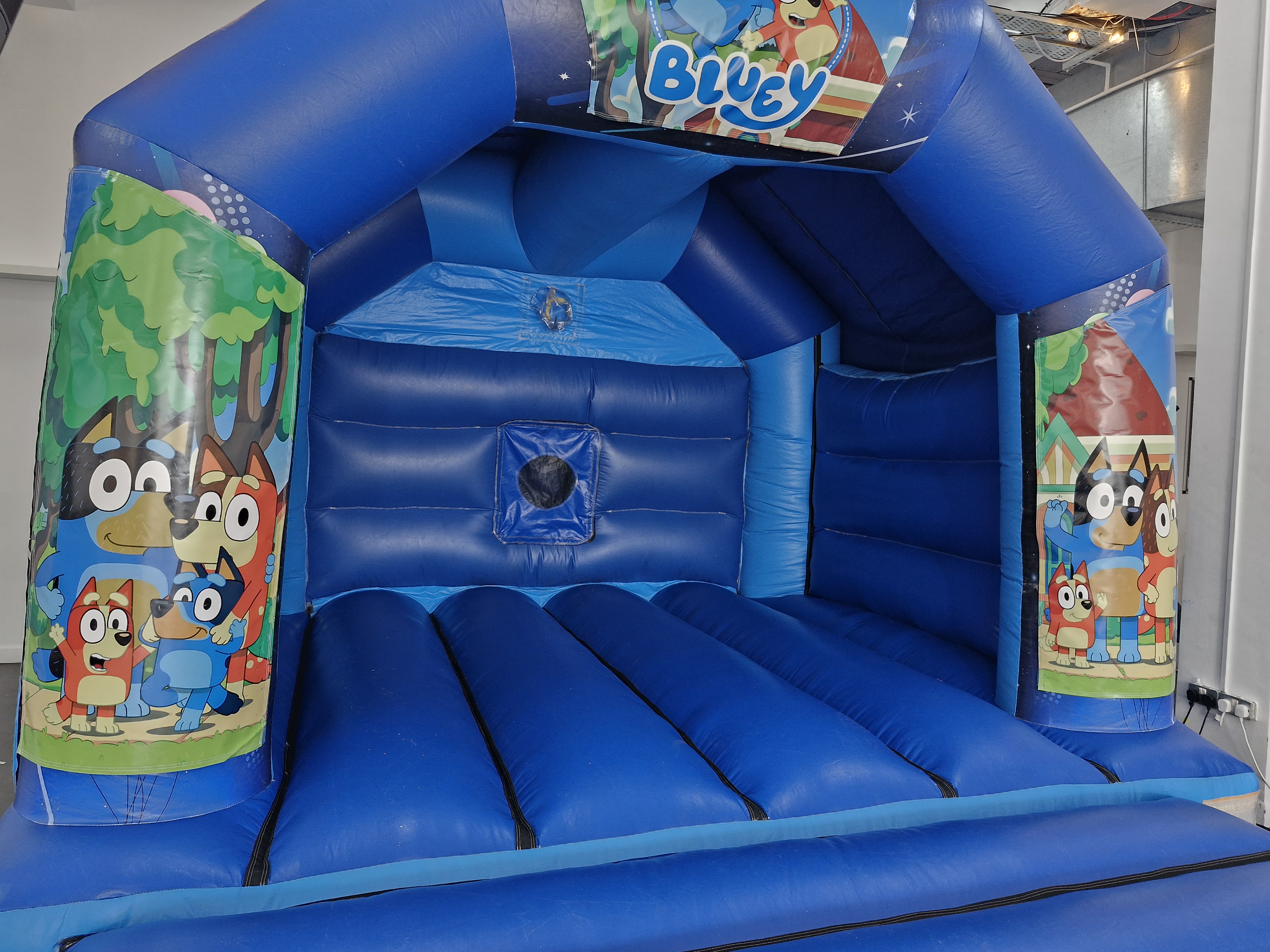 Inside the 12ft Bluey bouncy castle hire