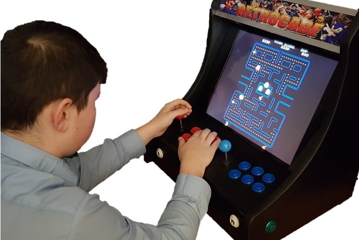 Child playing on the arcade