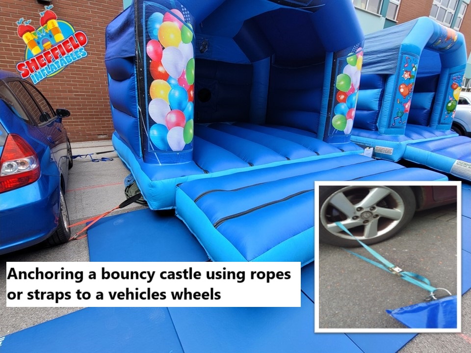 Anchoring a bouncy castle on tarmac using a car
